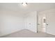 Bedroom featuring neutral carpet and a view into a bright hallway at 3567 New Hope Rd, Dacula, GA 30019