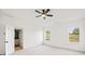 Bright bedroom with carpet, ceiling fan, and natural light at 3567 New Hope Rd, Dacula, GA 30019