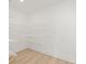 Walk-in closet featuring wood floors and white wire shelving at 3567 New Hope Rd, Dacula, GA 30019