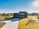 Beautiful two-story home featuring a spacious front yard, a large driveway, and a two-car garage at 3567 New Hope Rd, Dacula, GA 30019