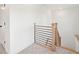 Hallway with horizontal iron railing and carpeted floors at 3567 New Hope Rd, Dacula, GA 30019