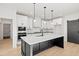 Modern kitchen featuring a large center island, custom cabinets, and stainless steel appliances at 3567 New Hope Rd, Dacula, GA 30019