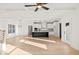 Spacious living room featuring hardwood floors, coffered ceilings, and a chef's kitchen at 3567 New Hope Rd, Dacula, GA 30019