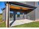 Inviting covered patio with ceiling fan, wooden ceiling, and backyard access at 3567 New Hope Rd, Dacula, GA 30019