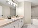 Bathroom features a double vanity, a large mirror, and a shower-tub combo at 1381 Vintage Pointe Dr, Lawrenceville, GA 30044