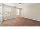 Bedroom with neutral walls, carpet, and a ceiling light at 1381 Vintage Pointe Dr, Lawrenceville, GA 30044