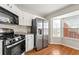 Bright kitchen with stainless steel appliances and a bay window at 1381 Vintage Pointe Dr, Lawrenceville, GA 30044