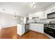 Open kitchen with stainless steel appliances and granite countertops at 1381 Vintage Pointe Dr, Lawrenceville, GA 30044