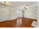 Spacious and airy living room featuring hardwood floors and ample natural light at 1381 Vintage Pointe Dr, Lawrenceville, GA 30044