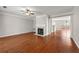 Bright living room boasts hardwood floors, fireplace, and elegant trimwork at 1381 Vintage Pointe Dr, Lawrenceville, GA 30044