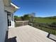 Back deck overlooking rolling hills and pasture is accessed from an exterior door at 32 Ne Moriah Way, Rydal, GA 30171