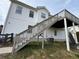 Back exterior view featuring stairs leading to a deck with railing at 32 Ne Moriah Way, Rydal, GA 30171