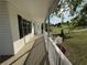Wide porch with white railings offering scenic views of the neighborhood at 32 Ne Moriah Way, Rydal, GA 30171