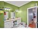 A bright bathroom featuring double sinks and updated fixtures at 340 Lazy Willow Ln, Lawrenceville, GA 30044