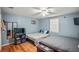 Spacious bedroom with two beds, wood floors, ceiling fan and a large window at 340 Lazy Willow Ln, Lawrenceville, GA 30044