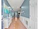Inviting entryway with hardwood floors, fresh paint, white trim, and a view to the main living area at 340 Lazy Willow Ln, Lawrenceville, GA 30044