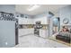 Updated kitchen with white cabinets, granite countertops, stainless appliances, and a trendy black refrigerator at 340 Lazy Willow Ln, Lawrenceville, GA 30044