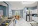 Updated kitchen features white cabinets, granite countertops, stainless appliances and a view to the dining area at 340 Lazy Willow Ln, Lawrenceville, GA 30044