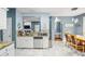 Bright kitchen features white cabinets, granite countertops, and stainless steel dishwasher and a marble-like floor at 340 Lazy Willow Ln, Lawrenceville, GA 30044
