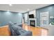Comfortable living room with a cozy fireplace, hardwood floors, and an outside exit at 340 Lazy Willow Ln, Lawrenceville, GA 30044
