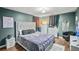 Stylish primary bedroom featuring hardwood floors, soft lighting, and modern gray decor at 340 Lazy Willow Ln, Lawrenceville, GA 30044