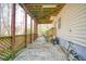 A covered back patio offers outdoor living space and hillside views at 340 Lazy Willow Ln, Lawrenceville, GA 30044