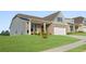 Attractive home with a covered porch, brick accents, and well-kept landscaping creating a welcoming curb appeal at 48 Masters Dr, Villa Rica, GA 30180