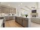 Modern kitchen with a large island, stainless steel appliances, and light wood flooring at 48 Masters Dr, Villa Rica, GA 30180