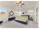 Spacious bedroom with large windows, tray ceiling, and modern decor at 48 Masters Dr, Villa Rica, GA 30180