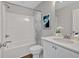 Bright bathroom featuring a shower/tub combo, vanity and framed mirror at 61 Colonial Terrace, Villa Rica, GA 30180