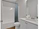 Clean bathroom featuring a shower-tub combination and a modern vanity with ample storage at 61 Colonial Terrace, Villa Rica, GA 30180