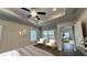 Bright bedroom with a trey ceiling, two chairs, and ample natural light at 61 Colonial Terrace, Villa Rica, GA 30180