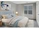 Beautifully staged bedroom with a padded headboard, large window, and stylish décor at 61 Colonial Terrace, Villa Rica, GA 30180