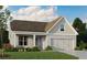 Charming single-story home with gray brick, attached garage, and well-maintained landscaping at 61 Colonial Terrace, Villa Rica, GA 30180