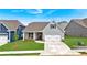 Attractive craftsman-style home featuring gray siding, a two-car garage, and a well-manicured lawn at 61 Colonial Terrace, Villa Rica, GA 30180