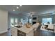 Modern kitchen featuring stainless steel appliances, granite countertops, and an open view to living space at 61 Colonial Terrace, Villa Rica, GA 30180