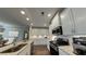 This modern kitchen features stainless steel appliances, granite countertops, and a breakfast nook at 61 Colonial Terrace, Villa Rica, GA 30180