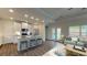 Stylish kitchen island featuring granite countertops, stainless steel appliances, and ample seating space at 61 Colonial Terrace, Villa Rica, GA 30180