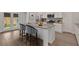 Kitchen island with granite countertops, stainless steel appliances, and stylish seating at 61 Colonial Terrace, Villa Rica, GA 30180