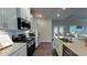 Modern kitchen with granite countertops, stainless steel appliances, and an open layout design at 61 Colonial Terrace, Villa Rica, GA 30180