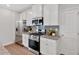 Well-equipped kitchen featuring stainless steel appliances, granite countertops, and ample cabinet space at 61 Colonial Terrace, Villa Rica, GA 30180