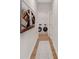 Hallway view into the laundry room, complete with a front loading washer and dryer at 61 Colonial Terrace, Villa Rica, GA 30180