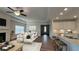 Bright and airy living room with wood floors, fireplace, and an open view to the modern kitchen at 61 Colonial Terrace, Villa Rica, GA 30180