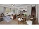Open-concept living room with staircase, dining area, and modern kitchen at 61 Colonial Terrace, Villa Rica, GA 30180