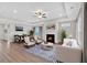 Spacious living room featuring a fireplace, tray ceiling, and an open-concept design at 61 Colonial Terrace, Villa Rica, GA 30180
