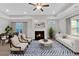 Bright and airy living room with a fireplace, tray ceiling, and stylish furniture at 61 Colonial Terrace, Villa Rica, GA 30180