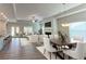 Open-concept living room with fireplace, wood floors, and lots of natural light, perfect for entertaining at 61 Colonial Terrace, Villa Rica, GA 30180