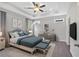 Elegant main bedroom with tray ceiling, large bed, and coordinated furniture at 61 Colonial Terrace, Villa Rica, GA 30180