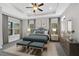 Elegant main bedroom with tray ceiling, large bed, and coordinated furniture at 61 Colonial Terrace, Villa Rica, GA 30180
