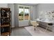 Bright home office with a large window, neutral decor, and modern desk setup at 61 Colonial Terrace, Villa Rica, GA 30180